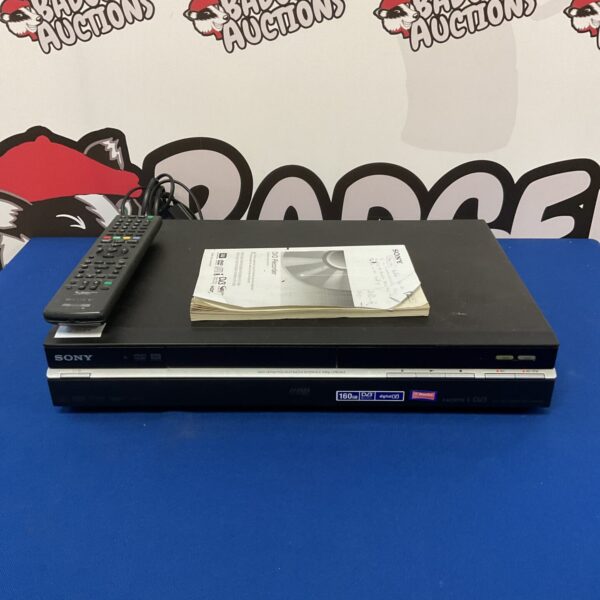 Black Sony DVD recorder with remote control for retro home cinema.