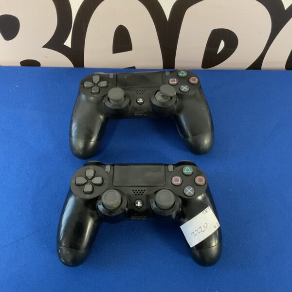 Two Sony PlayStation 4 DualShock 4 controllers for gaming.