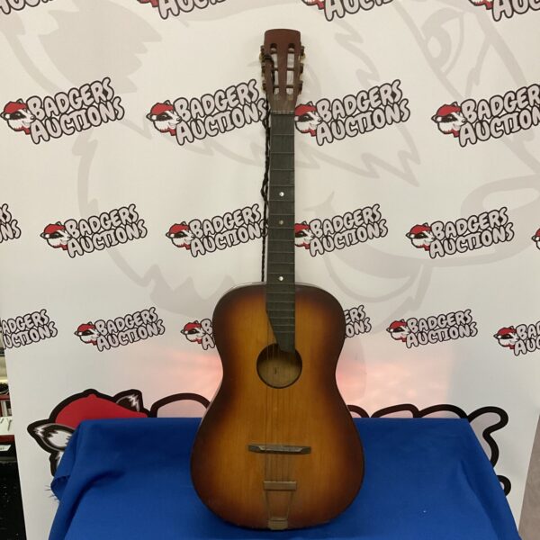 Vintage Spanish acoustic guitar with warm wood tones.