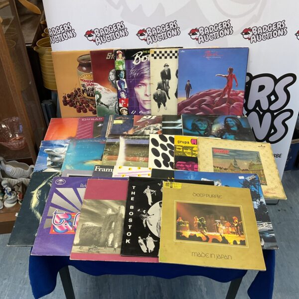 Vintage vinyl record collection featuring David Bowie and The Specials.