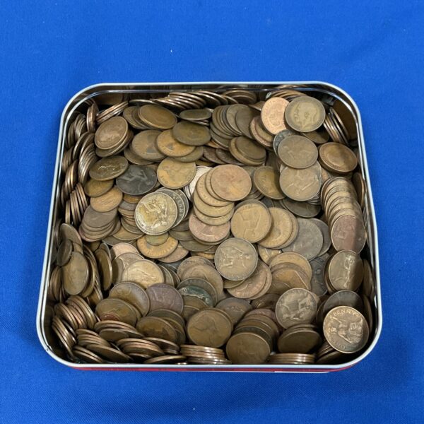 Tin filled with a large quantity of pre-decimal British copper coins.