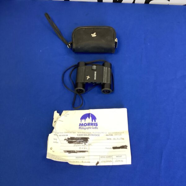 Vintage Swarovski 8x20 binoculars with original receipt displayed.