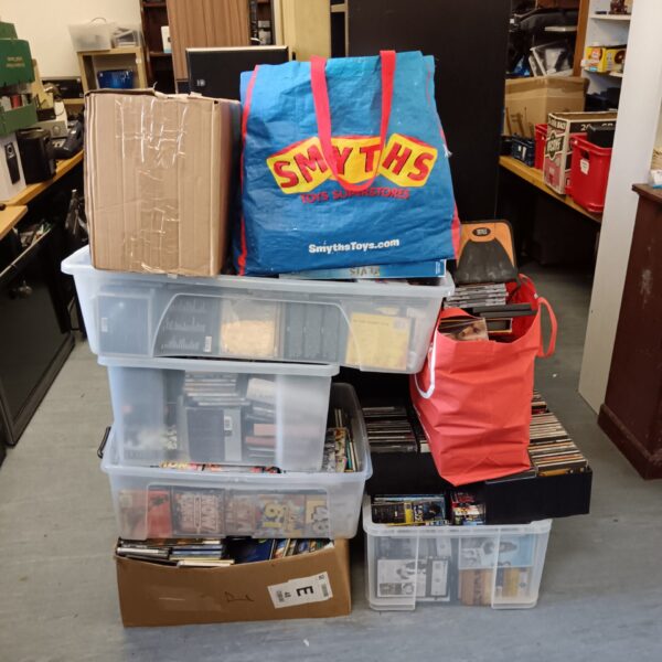 Large music CD collection stored in plastic containers.