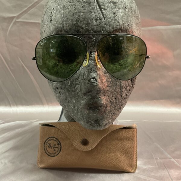 Vintage Ray Ban aviator sunglasses with gold frames and gradient lenses.