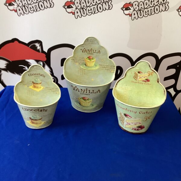 Set of three vintage-style kitchen storage boxes.