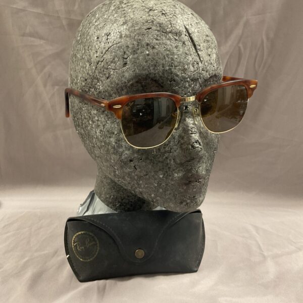 Vintage Ray Ban sunglasses in case, classic retro eyewear.