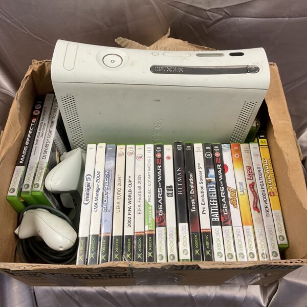 Xbox 360 console bundle with various video games included.