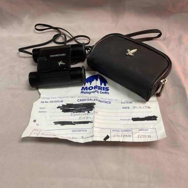 Vintage Swarovski pocket binoculars with original invoice.