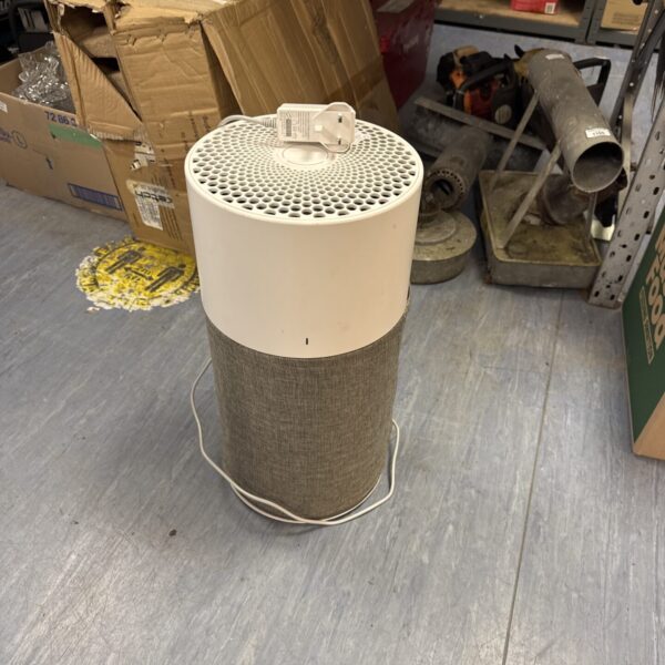 Side view of a blue air purifier for home use.