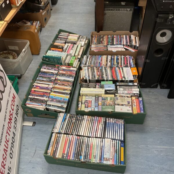 Mixed lot of music CDs, cassettes, and DVDs for collectors.
