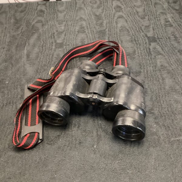 Vintage Halina Discovery 8x40 binoculars with neck strap.