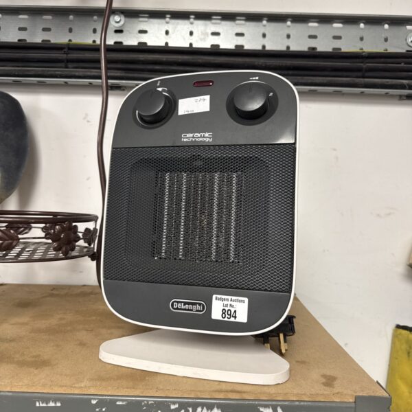 Front view of a Delonghi ceramic heater in as-found condition.