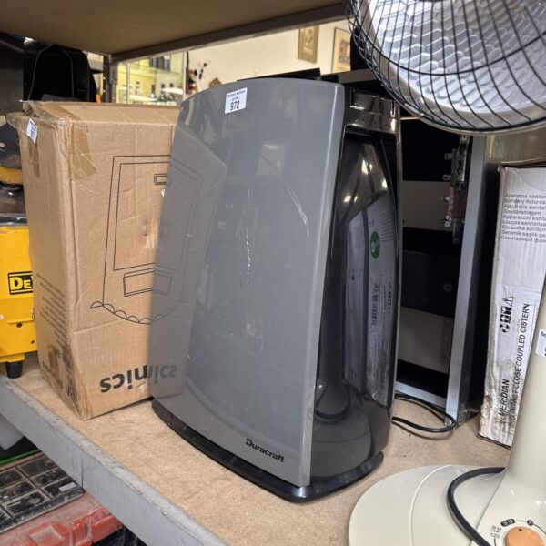 Vintage Duracraft dehumidifier in used condition, retro home appliance.