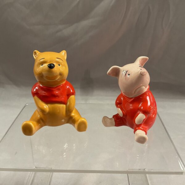 Vintage Beswick Winnie the Pooh and Piglet figurines on display.