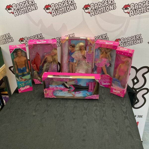 Boxed 1990s Barbie dolls, a vintage fashion doll collection.