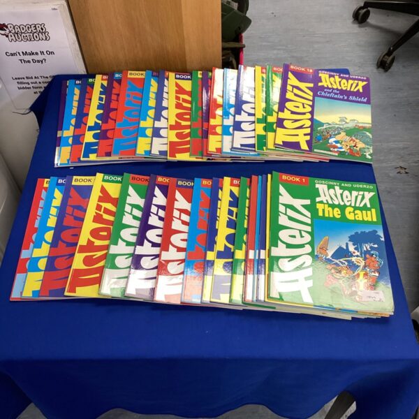 Vintage Asterix comic books stacked together, a classic French collection.