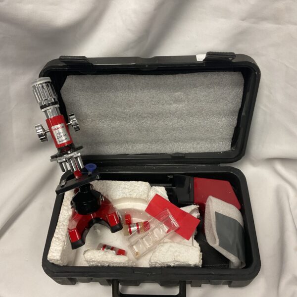 Vintage Tasco 959p microscope in a carrying case.