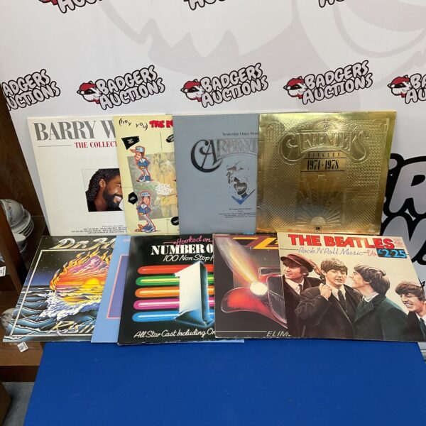 Vintage vinyl record collection featuring The Beatles and other artists.