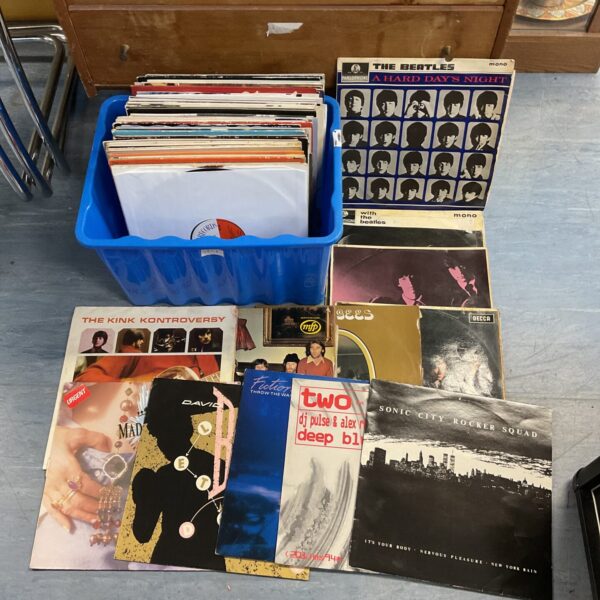 Vinyl record lot featuring Beatles and David Bowie albums.
