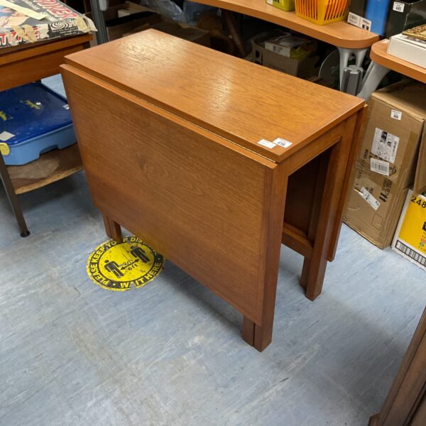 Vintage mahogany gate leg table with drop leaf design.