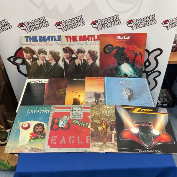 Selection of vintage vinyl records including Beatles and Meatloaf albums.