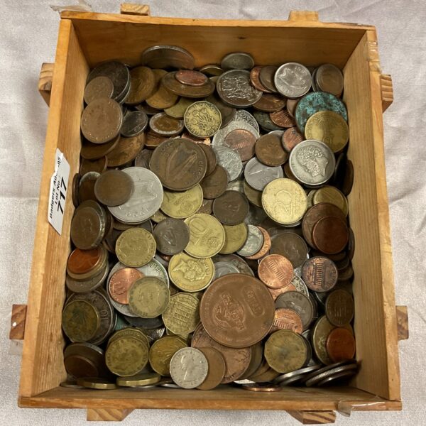 Assorted coin lot displayed in a wooden box.