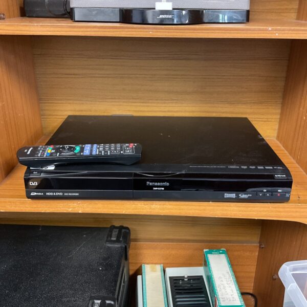 Black Panasonic DMC-EX768 DVD recorder with front controls visible.