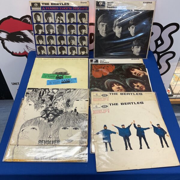 Lot of nine vintage Beatles vinyl records for collectors.