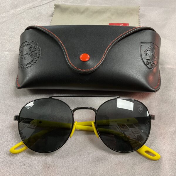Front view of Ray Ban Ferrari sunglasses with dark tinted lenses.