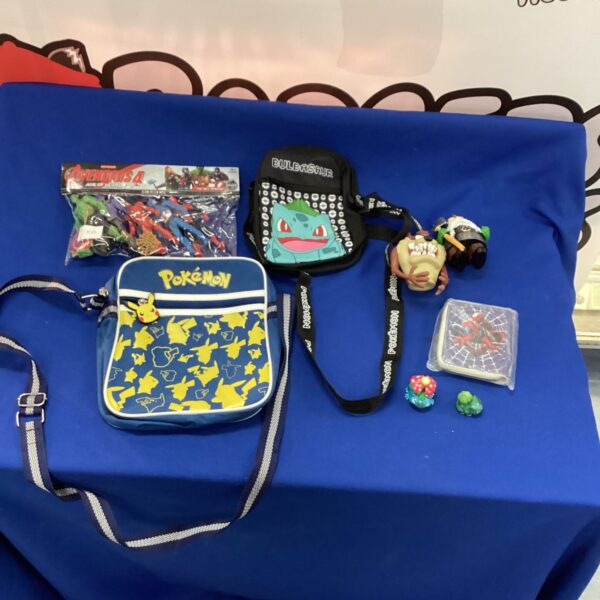 Pokémon mixed lot featuring lanyard and plush toy.