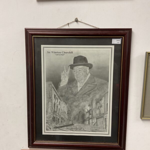 Framed vintage print of Winston Churchill, a historical figure.