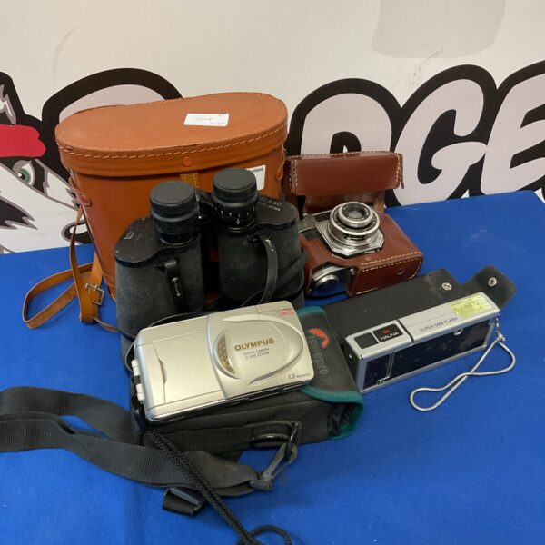 Vintage camera lot featuring an Olympus camera and binoculars.
