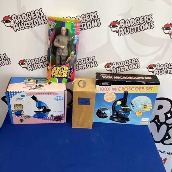 Vintage child's microscope set with Austin Powers figure, educational toy.