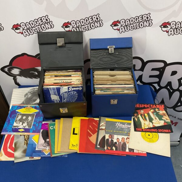 Vintage 7 inch vinyl records lot with empty sleeves, music collectibles.