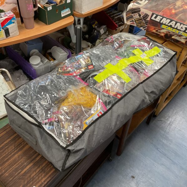 Large sack of mixed Lego building blocks, including Marvel and Harry Potter pieces.