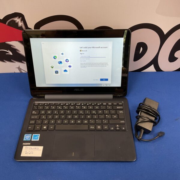 Asus laptop displaying the Windows 11 login screen, a portable computer.