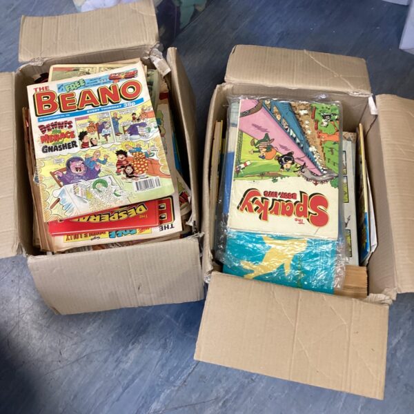 Two boxes filled with vintage British comics and annuals.