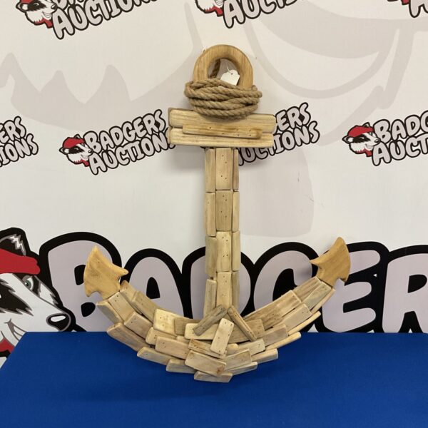 Large driftwood anchor for nautical coastal home decor.