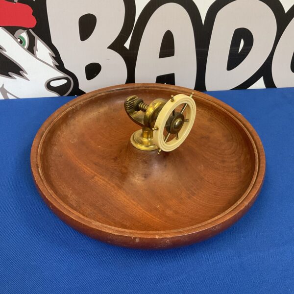 Vintage wooden ships wheel nutcracker for collectors.