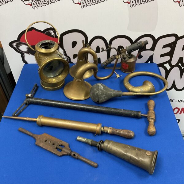 Vintage brass horn with a curved design, antique collectible.