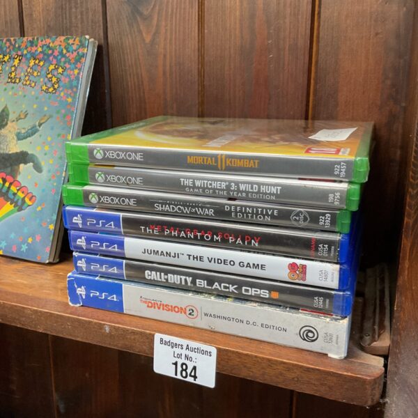 Selection of PlayStation 4 and Xbox One video games for sale.
