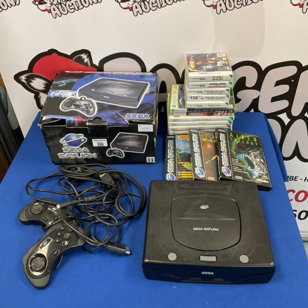 Sega Saturn console boxed with controllers and games for retro gaming.