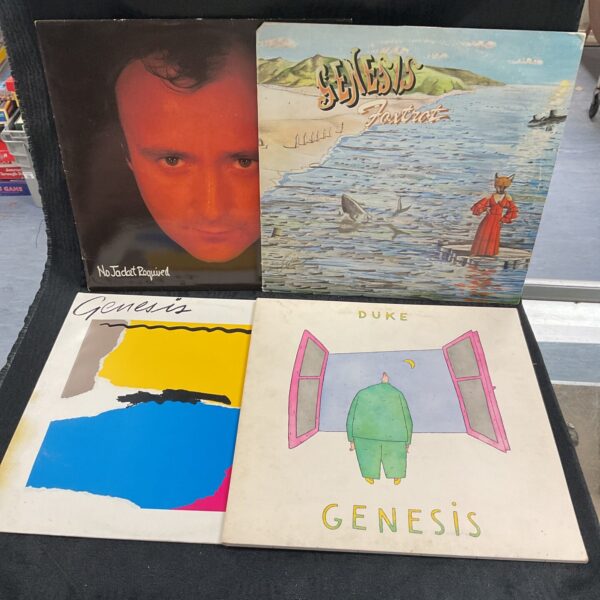 Lot of four vintage Genesis vinyl records for collectors.