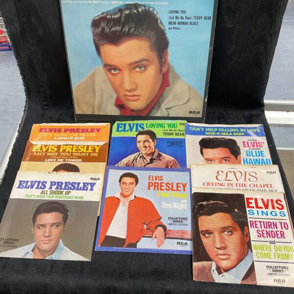 Elvis Presley vinyl record collection featuring 7 and 12 inch records.