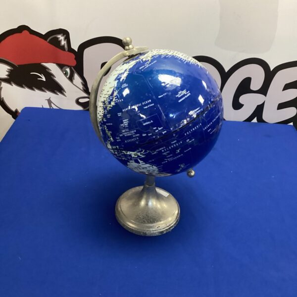 Detailed vintage world globe on a metal base.