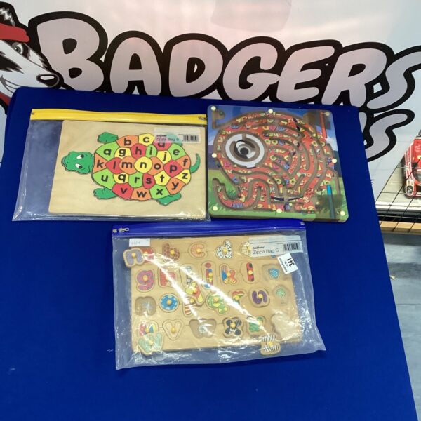 Vintage wooden child's puzzle lot with colourful pieces.