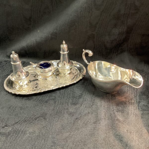 Antique silver plate condiment set with tray and jug.