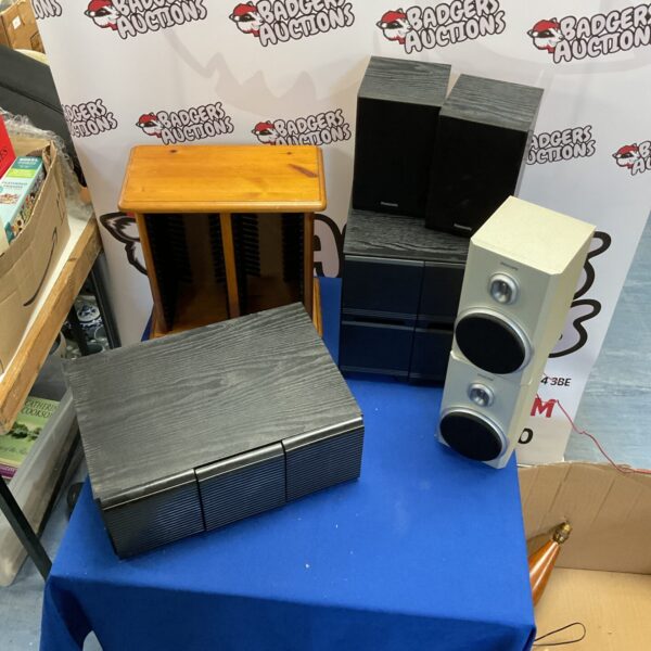 Vintage cassette storage and Panasonic Phillips speakers for retro audio.