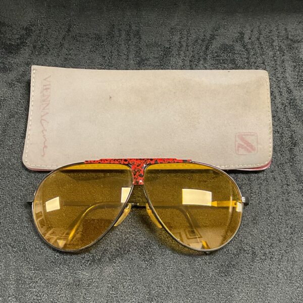 Vintage Vienna Line sunglasses with yellow tinted lenses and metal frame.