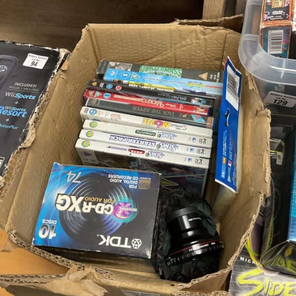 Mixed lot of DVDs, CDs, and computer games for sale.